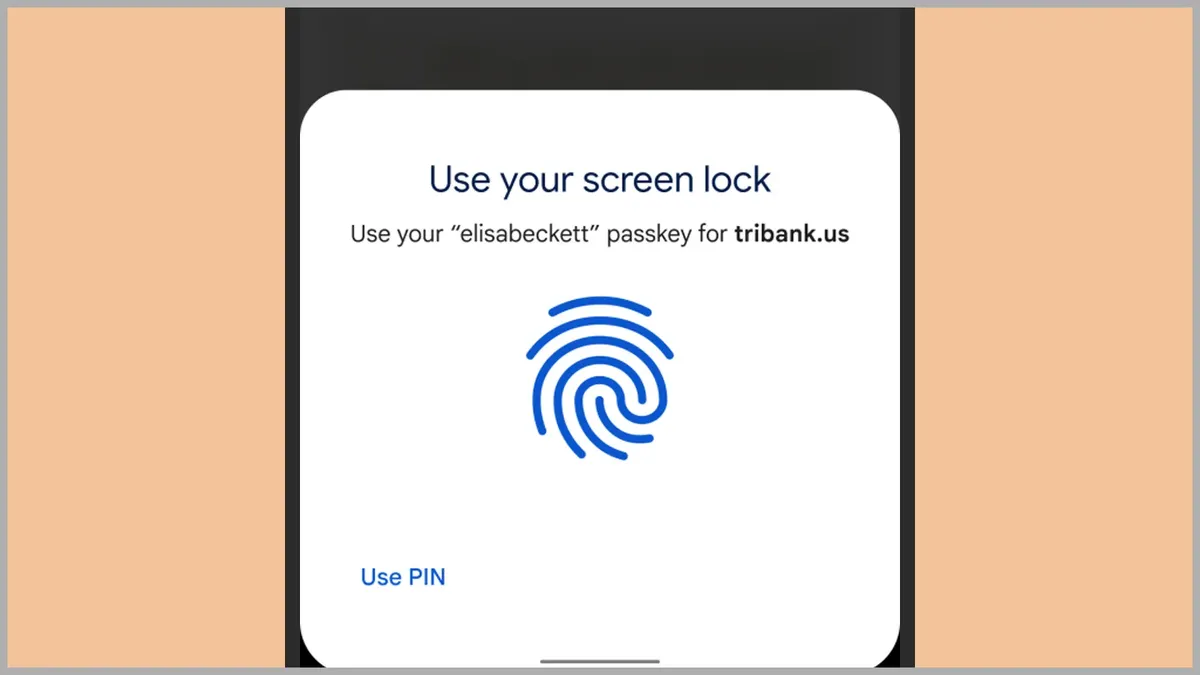 Ecran de telefon cu cererea de deblocare: „Use your screen lock”, dedesubt „Use your «elisabeckett» passkey for tribank.us”, o amprentă desenată în albastru și linkul „Use PIN” în colțul de jos