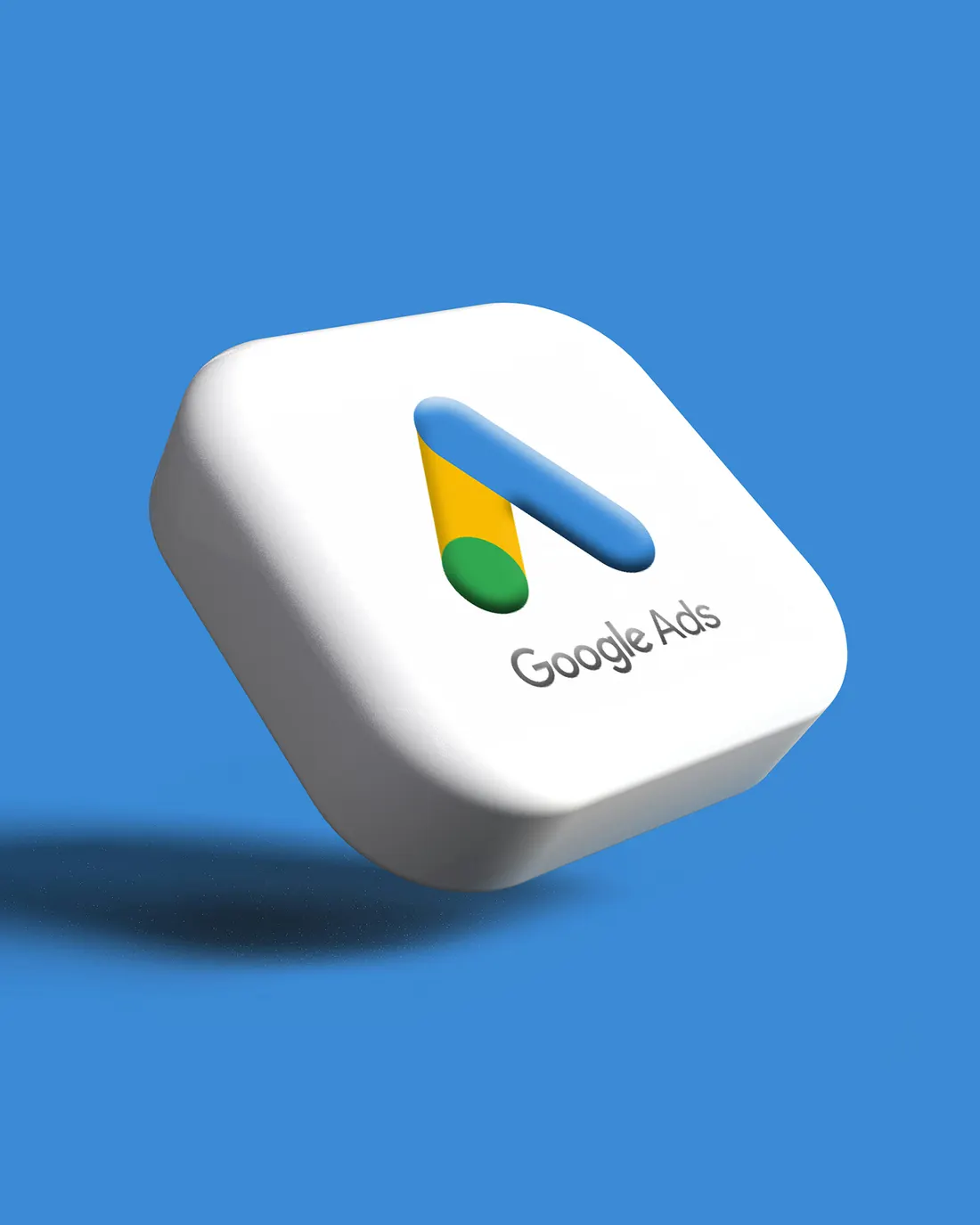The Google Ads symbol, rendered in 3D on a blue background